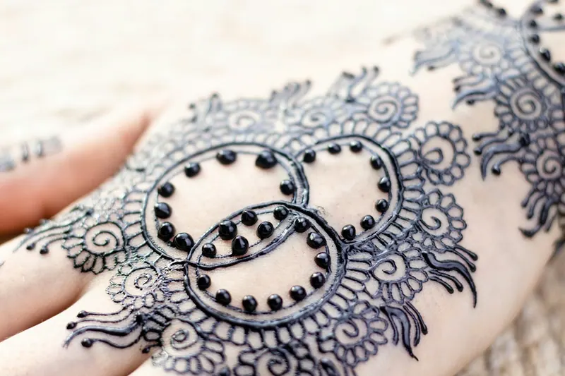 Detailed bridal mehndi design on a hand