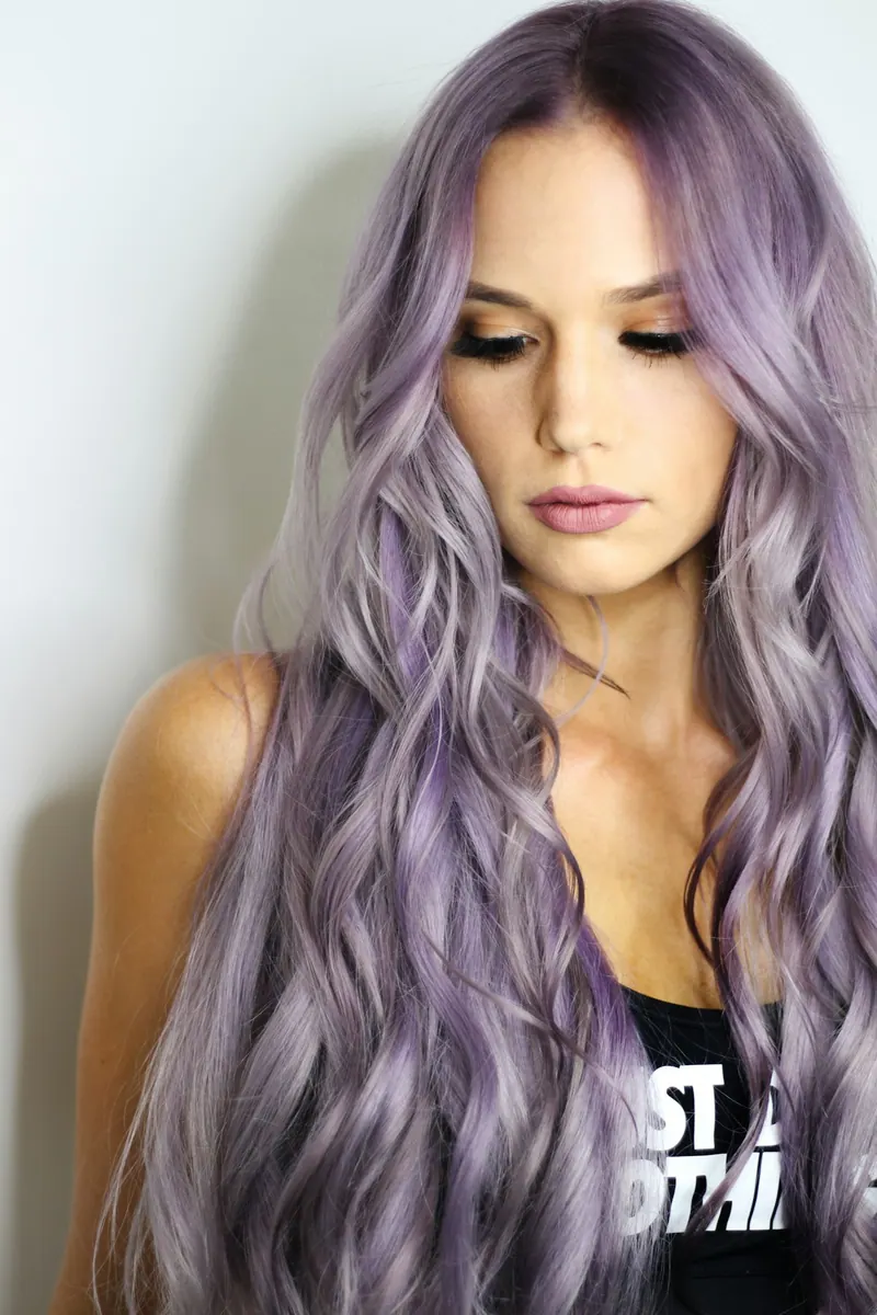 Woman with long lavender-coloured wavy hair